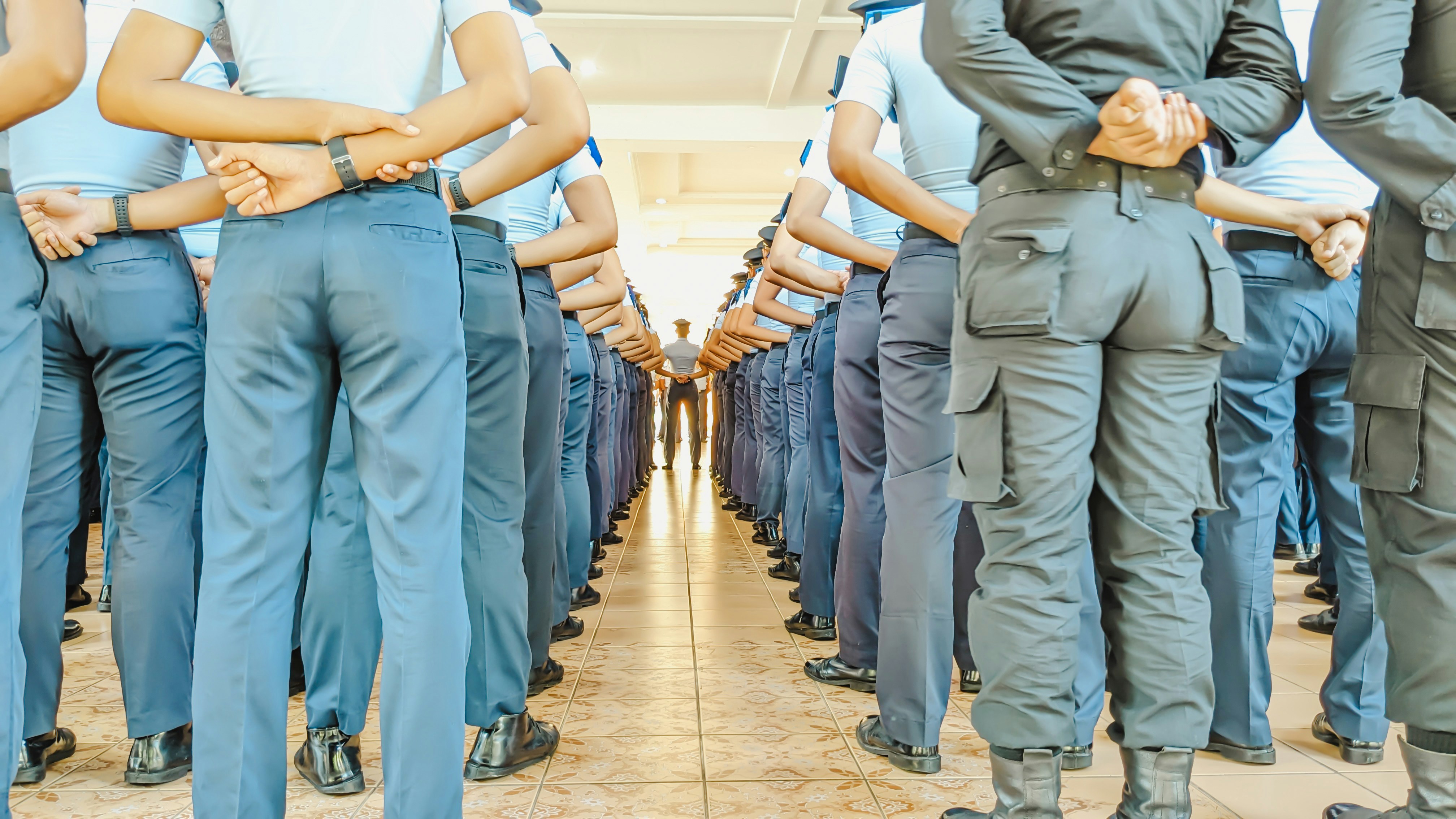 Selective focus. Rear view of The line of Vocational Cadets in uniform waiting for the leader briefing on the Morning Assembly